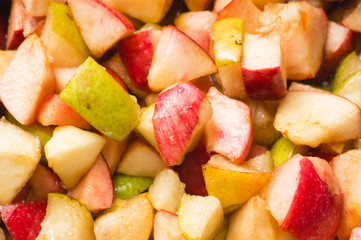 Ripe apples and pears cooked in sugar syrup. Process of making jam marmalade at home.