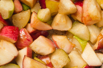 Ripe apples and pears cooked in sugar syrup. Process of making jam marmalade at home.