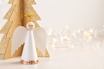 Christmas greeting card mock up with paper angel and christmas tree