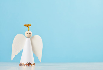 Christmas greeting card mock up with paper angel and christmas tree