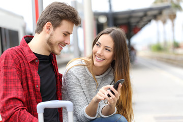 Couple talking about online content in a phone