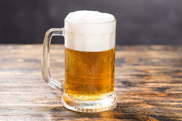 Alcohol, liquid, food concept - mug of beer on a table