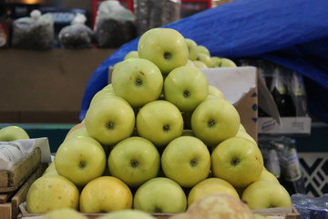 Organic apples pyramid at market