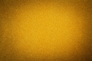 Vignetted golden new year glittering background