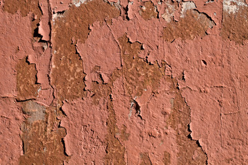 Background texture of the old shabby wall with cracks closeup