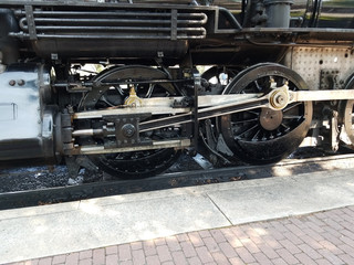 Fototapeta na wymiar Steam Locomotive Warming up a Train Station