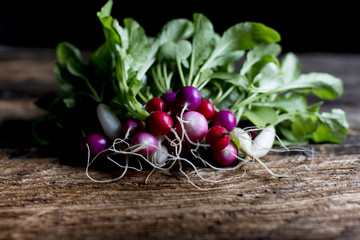 Bunch of radishes on wooden table