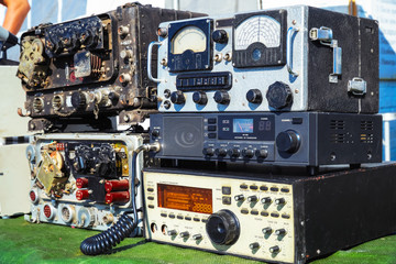 Old radio engineering devices. Scale with arrow, transceiver, measuring instruments