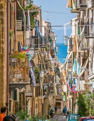 Foto op Plexiglas A cozy street in Cefalù on a sunny summer day. Sicily, southern Italy. © e55evu