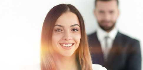 portrait of a business woman while the man is in the background