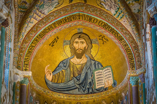 Golden mosaic with Christ Pantocrator in the apse of Cefalù Cathedral. Sicily, southern italy.