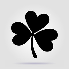 Shamrock black vector icon on gray background