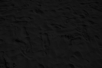 Toned sandy texture with footprints
