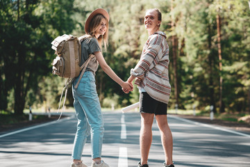 Obraz premium Traveler couple in love enjoying holding hands each other and looking forward to a joint journey. Young happy family traveling active adventure vacations