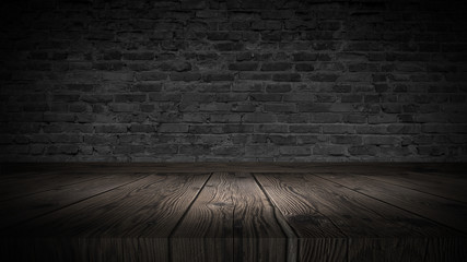 background of an empty black room, a cellar, lit by a searchlight. Brick black wall and wooden floor