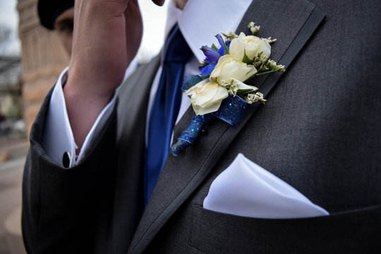 man in suit with flower
