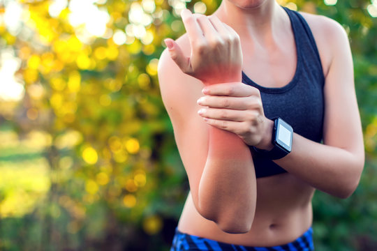 Woman have a wrist pain outdoor. Healthcare, medicine and people concept