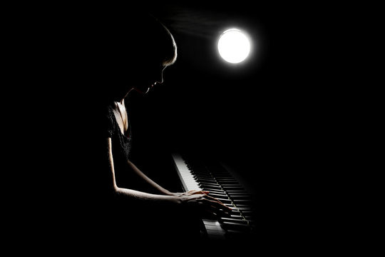 Piano Player. Woman Playing Piano Concert. Pianist Classical Musician