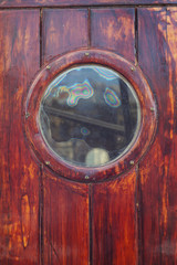 Bulls eye round window from old pirate ship 