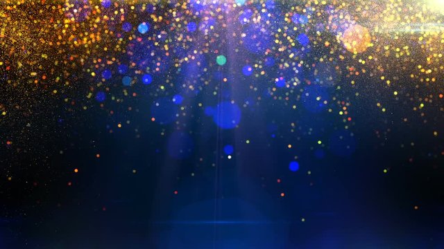 Gold particles falling down on blue background with flares loop
