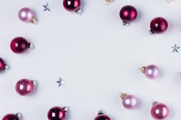 Christmas flat lay top view frame with pink abd violet glass balls