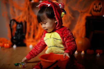 Toddler girl dressed up playing in Halloween party © M-image