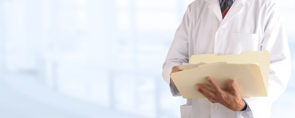Doctor over an out of focus Medical Office background