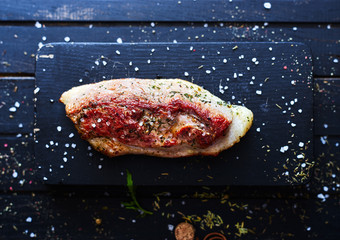hot grilled duck fillet with spices on a wooden board top view (series №1)