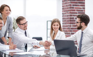 handshake colleagues at a working meeting
