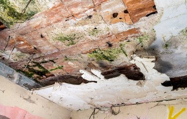 Ruined ceiling in an old abandoned house.