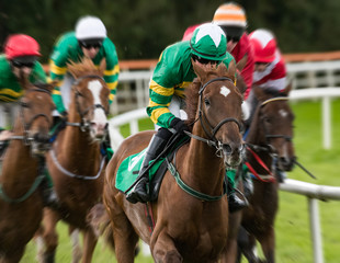 Close-up on galloping race horses and jockeys racing, Motion blur speed effect background