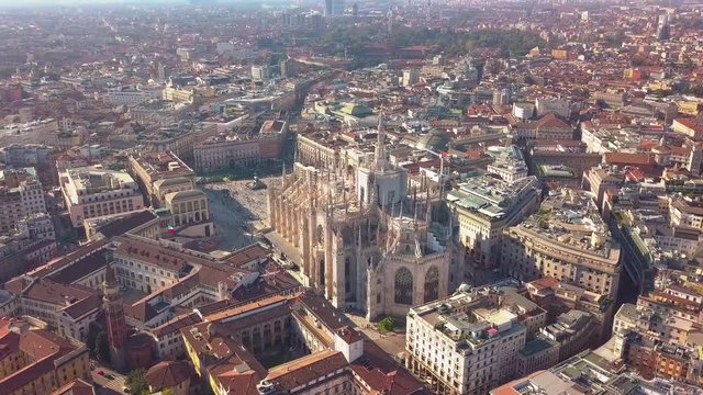 Aerial drone footage of famous statue on cathedral Duomo of Milan Italy