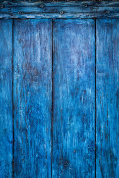 Bright blue painted old board, boho abstract background
