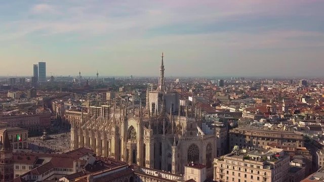 Aerial drone footage of famous statue on cathedral Duomo of Milan Italy