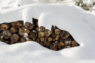 Pile of Firewood Outdoor Covered in Fresh Snow