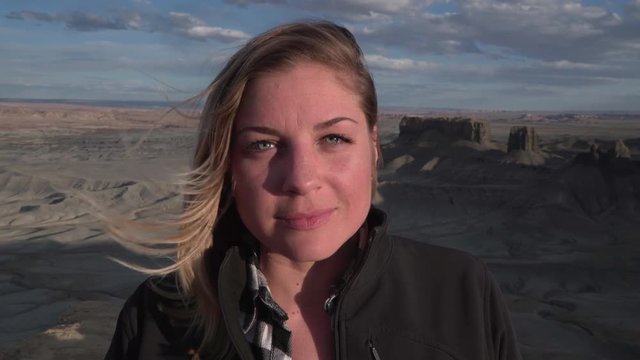 Portrait of young woman ontop a desert plateau