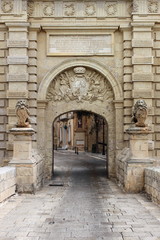 Fototapeta na wymiar Ancient limestone gateway into city of Mdina, Malta