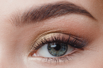 Fototapeta na wymiar Eyelash extension procedure. Beautiful female eyes with long lashes, closeup