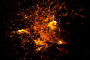 Fototapeta na wymiar Beautiful bonfire with sparks flying upwards, view from above