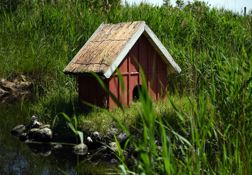 Duck house at a pond