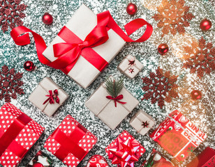 View from above, top, flat on Xmas present boxes and red globes, balls, package, decorative...