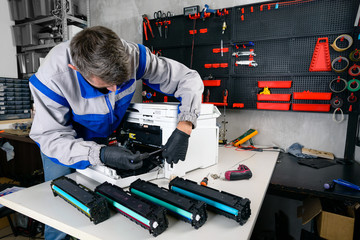 master professional refills laser printer cartridges in the workshop