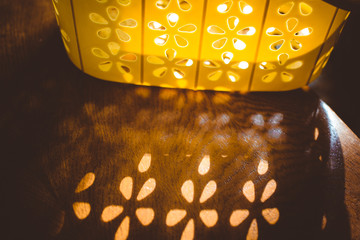Yellow basket on the table, play of light
