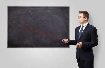 Handsome young teacher with laser pointer teaching 
