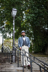 Elegant french man in the stairs of Paris Montmartre during the fifties