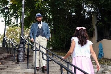 Man waiting for his wifre in the stairs of montmartre in Paris