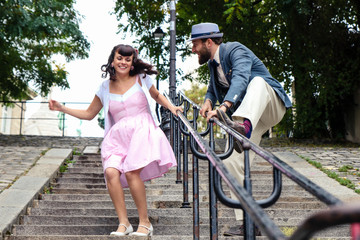 Couple having fun in the stairs of Montmartre in Paris
