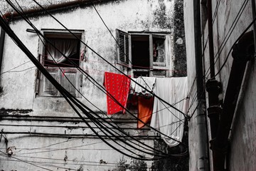 Tanzania. Stone Town. The linen drying on the street behind the window/