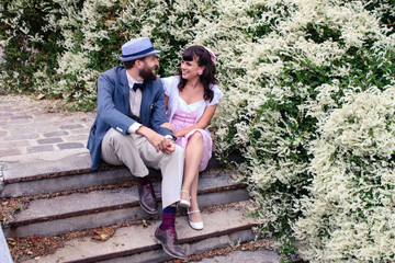 Couple sitting in the stairs of Montmartre in love