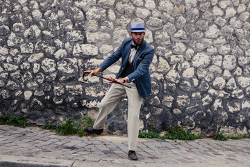 Dancing hipster man in vintage suit